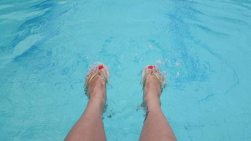 Low section of woman in swimming pool