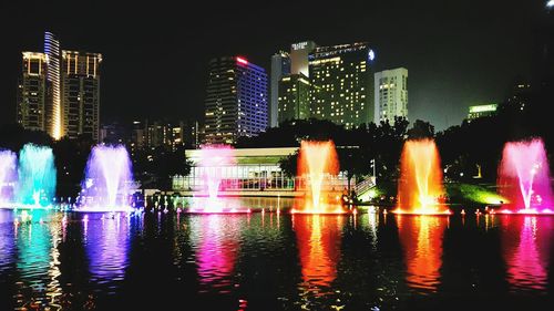 Illuminated buildings in city at night