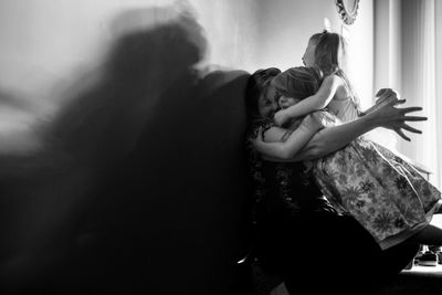 Mother and daughters at home