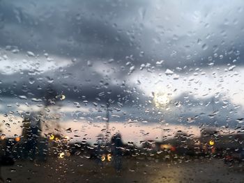 Raindrops on glass window during rainy season