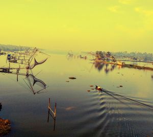 Scenic view of lake against sky during sunset