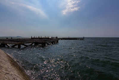 Pier over sea against sky