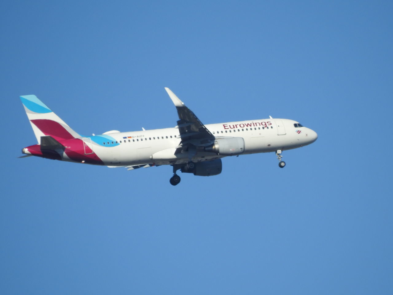 LOW ANGLE VIEW OF AIRPLANE FLYING IN SKY