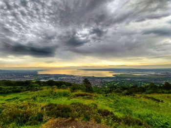 Scenic view of dramatic sky over land