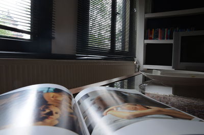 Close-up of book on table at home
