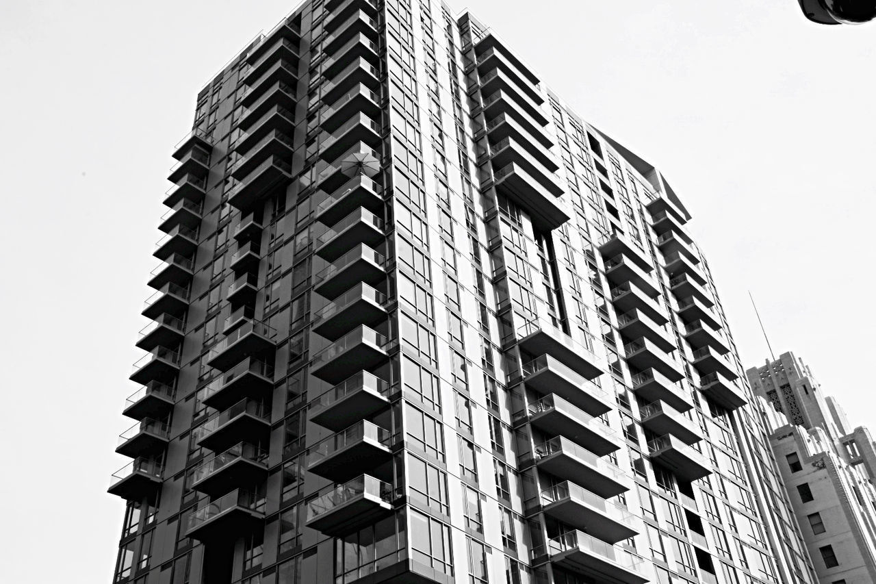 LOW ANGLE VIEW OF BUILDINGS AGAINST CLEAR SKY