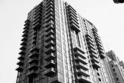 Low angle view of modern building against clear sky