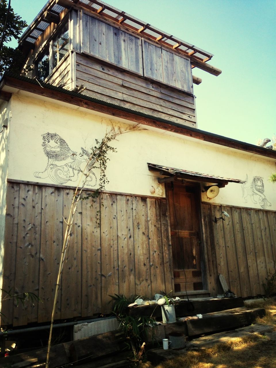 built structure, architecture, building exterior, abandoned, old, obsolete, house, weathered, damaged, run-down, clear sky, deterioration, low angle view, wood - material, residential structure, bad condition, day, outdoors, no people, sunlight