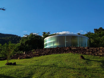 Built structure on field against clear sky