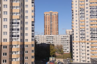 Buildings in city against clear sky