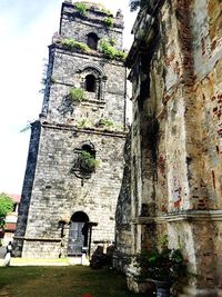 Low angle view of bell tower against sky