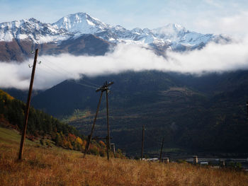 Scenic view of snowcapped mountains against sky