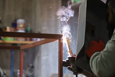 Low section of man working in factory