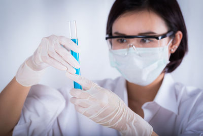 Female scientist holding medical sample at laboratory