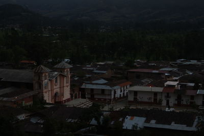 High angle view of buildings in city at night