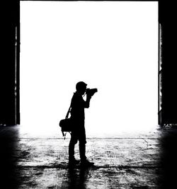 Silhouette man photographing