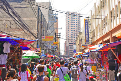 People on street market in city