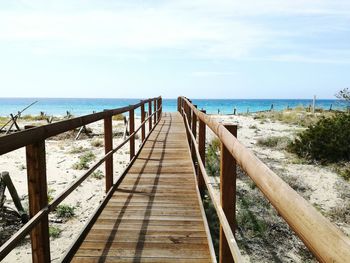 Pier over sea against sky