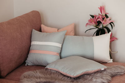 Close-up of flower on sofa at home