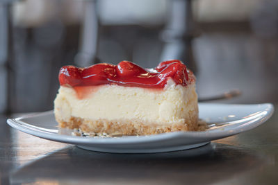 Close-up of cake slice in plate on table