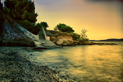 Scenic view of sea at sunset