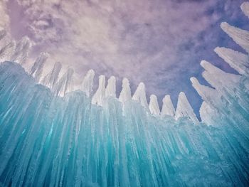 Close-up of ice against blue sky