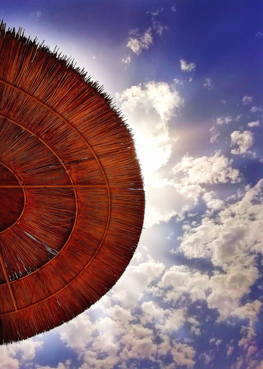 cloud - sky, sky, low angle view, nature, no people, day, outdoors, sunlight, shape, beauty in nature, design, architecture, pattern, cloudscape, geometric shape, circle, sunbeam, scenics - nature, freedom, tranquility