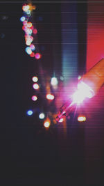 Blurred motion of person hand on illuminated city at night