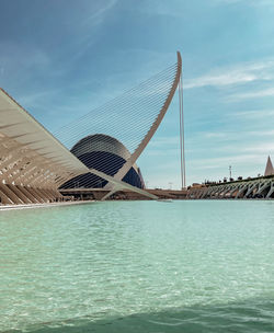 View of swimming pool by sea against sky