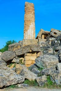 Low angle view of historical building against blue sky