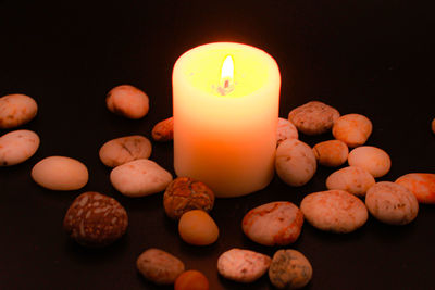 High angle view of candles on table against black background