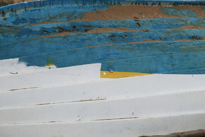 High angle view of yellow wall by swimming pool