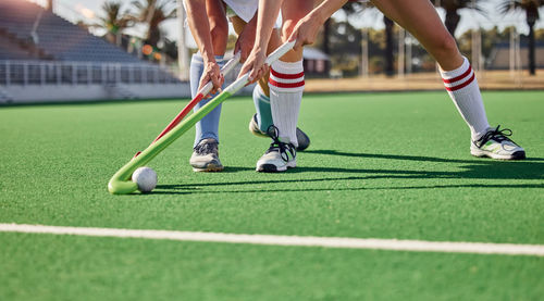 Low section of man playing soccer