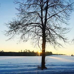 Scenic view of frozen lake against sky during winter