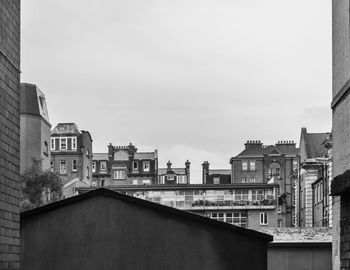Buildings in city against sky