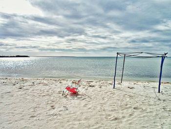 Boy on beach against sky