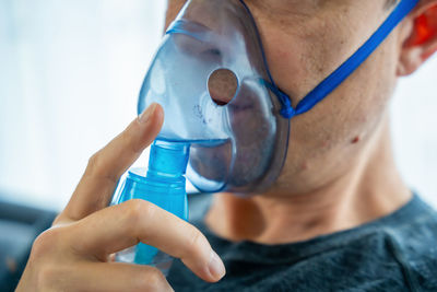 Close-up of man drinking water