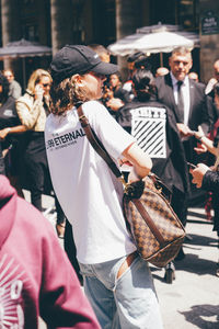 People walking on street in city