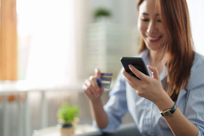 Young woman using mobile phone