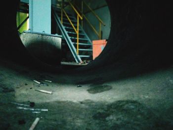 Close-up of bicycle wheel against wall