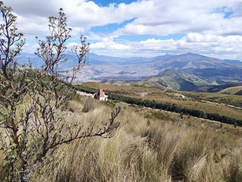 Scenic view of landscape and mountains against sky