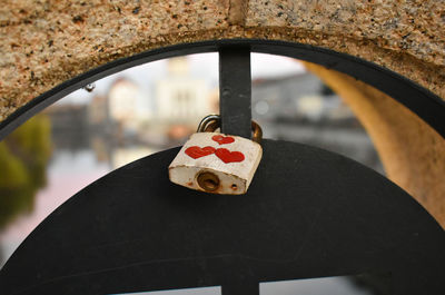 Close-up of padlocks hanging on metal