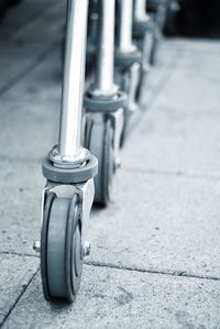 Cropped image of shopping carts on footpath