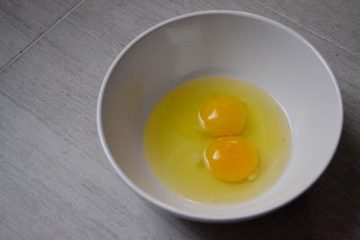 High angle view of egg in bowl on table