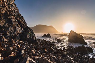 Scenic view of sea against sky during sunset