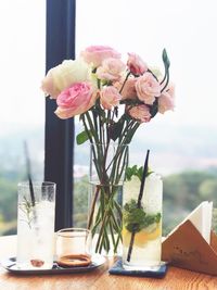 Close-up of roses in vase on table