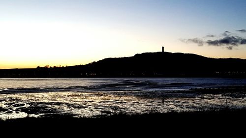 Scenic view of mountains at sunset
