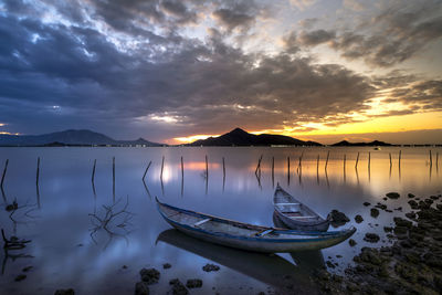 Scenic view of lake against sky during sunset