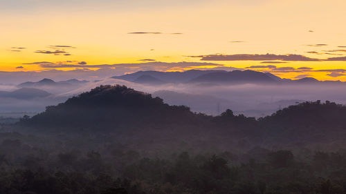 Scenic view of mountains against sky during sunset