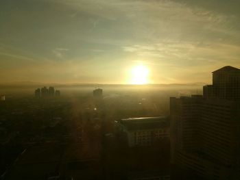 Cityscape against sky during sunset